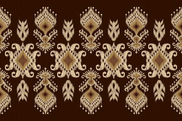 美丽的伊卡特涡纹花纹在棕色背景。图片下载