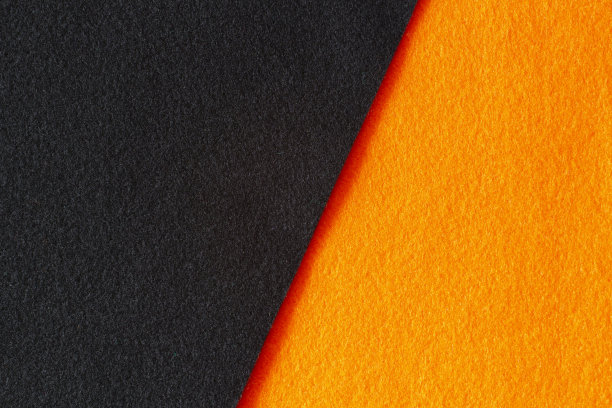 橙黑色毛毡织物质地背景。俯视图图片下载