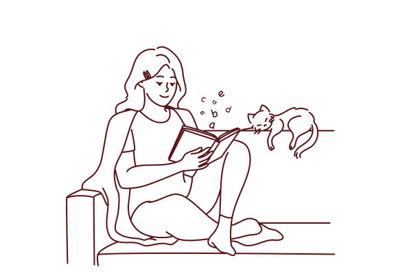 快乐的女人坐在沙发上看书图片下载