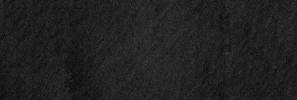 深色石材墙面背景。空宽黑石纹理。图片下载