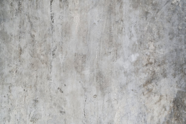 灰色的混凝土墙，有脏的痕迹和裂缝图片下载