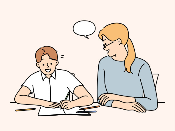 妈妈和微笑的儿子一起做作业图片下载