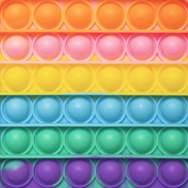 背景的流行流行它指尖玩具。简单的酒窝纹理图片下载