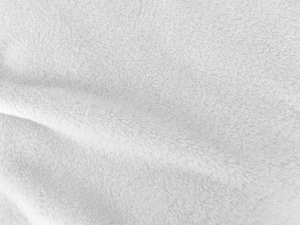 白色干净的羊毛质地背景。轻天然羊毛。白色的无缝的棉花。为设计师设计的毛茸茸的皮毛。特写片段白色羊毛地毯。图片下载