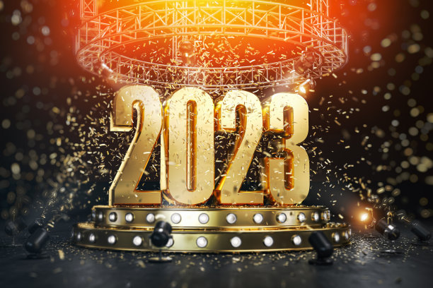 2023年新年快乐，在有聚光灯和五彩纸屑的讲台上。图片下载