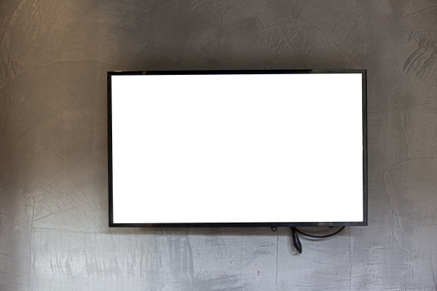 宽屏幕电视在灰色的墙背景图片下载
