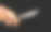 特写男性手握锋利的刀孤立在黑色背景图片下载