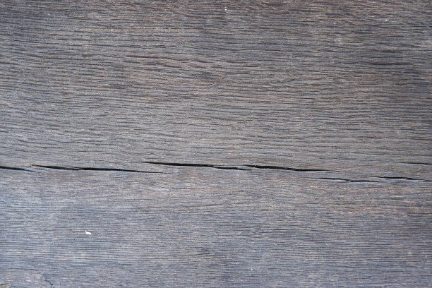 一块风化的旧橡木木板的表面岁的木材纹理。橡木木纹，背景。天然木板质地大理石木材图片下载