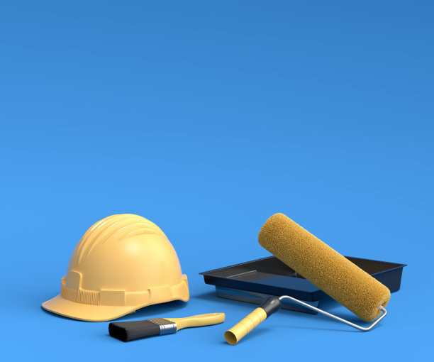 一套安全帽，用油漆辊和刷子在蓝色背景上喷涂。图片下载