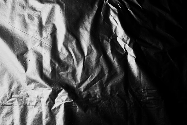 黑色玻璃纸袋特写背景质感的塑料图片下载