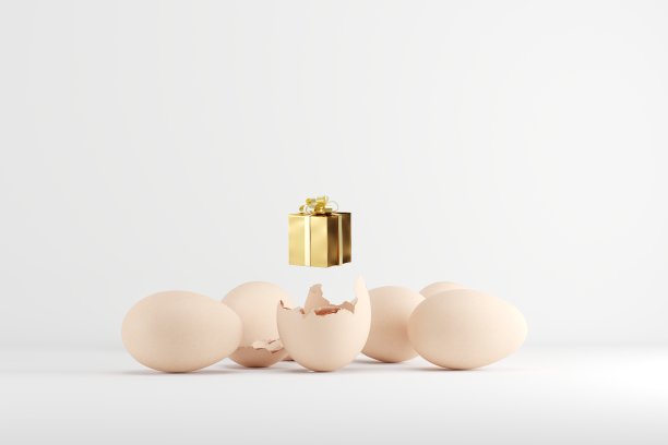 金色礼品盒的鸡蛋在白色的背景。图片下载