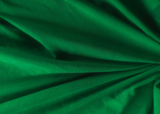 抽象质感的绿色缎面织物。图片下载