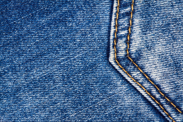 部分蓝色牛仔牛仔裤背景口袋与缝和橙色线缝合图片下载