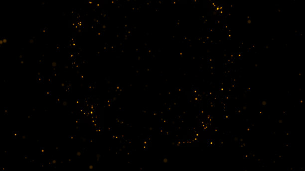 金色粒子抽象背景，美丽的未来在空间闪烁在黑色背景。图片下载