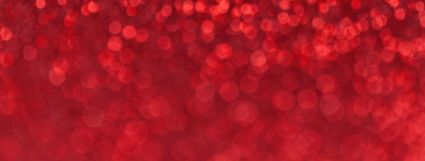 模糊亮红色闪闪发光的背景小亮片，微距。明亮的钻石红宝石离焦背景图片下载