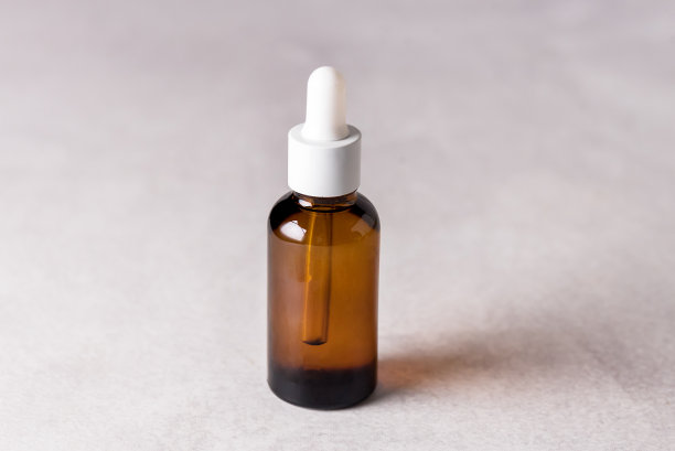 灰色底色玻璃瓶精华香薰油天然化妆品水平概念图片下载