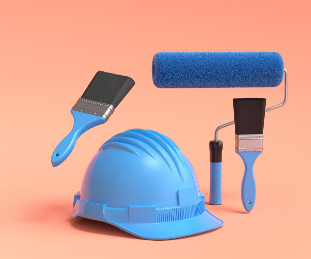 一套安全帽，用油漆辊和刷子在橙色背景上喷涂。图片下载