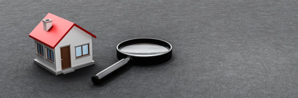 房子和放大镜在黑暗的背景图片下载