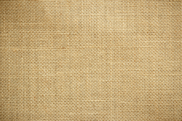 黄麻麻织麻袋布，麻布质地图案背景为浅米色奶油棕色空白色。天然编织的帆布纤维线棉布质地为清洁的有机装饰。图片下载