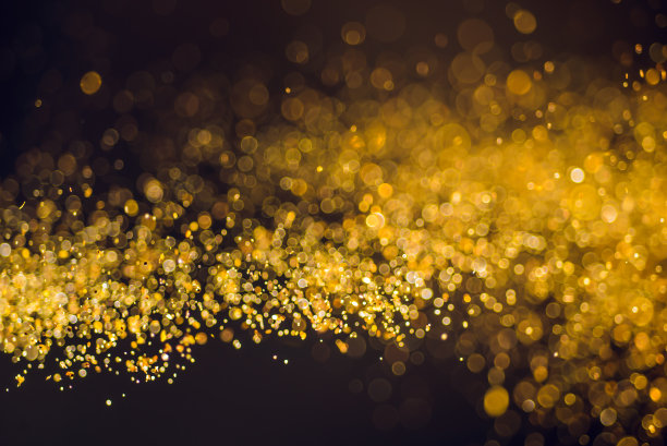 金色闪烁抽象节日圣诞灯背景。图片下载
