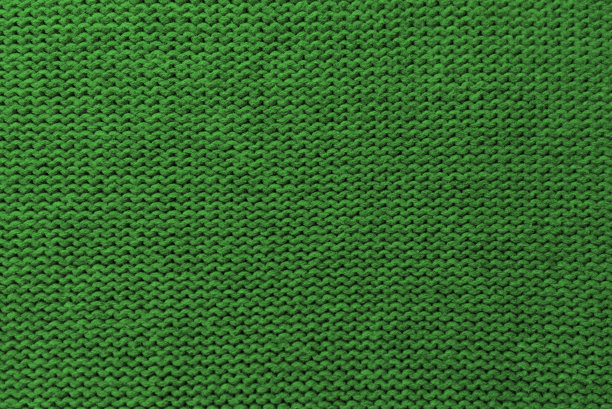 针织绿色图案特写，详细的纱线背景。图片下载