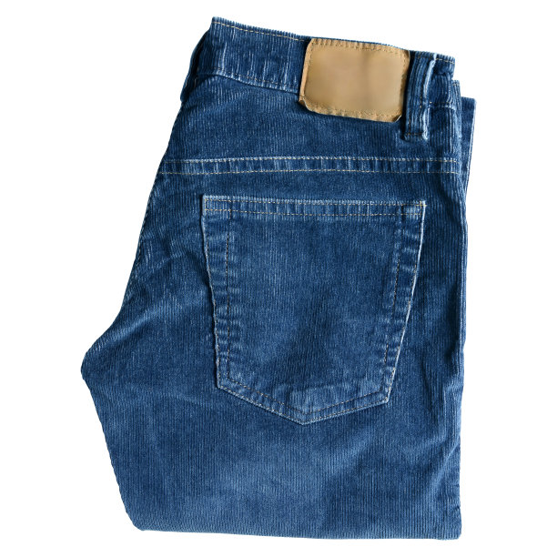 折叠灯芯绒蓝色牛仔裤隔离在白色背景图片下载