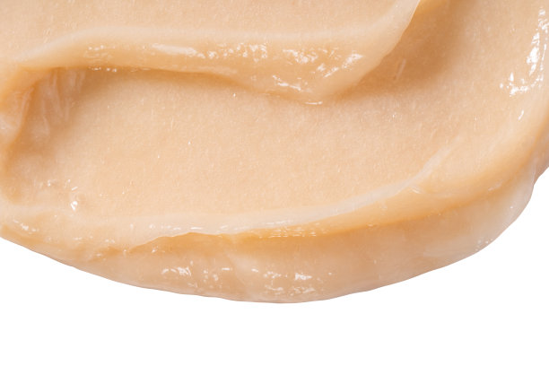 护发素霜色块涂抹在白色背景上。黄色化妆品润肤水样品特写。身体护理香脂，视黄醇精华液，洗发水波浪质感。护肤面膜，乳状洁面产品图片下载