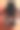 橙色表面上的无线耳机和手机特写镜头图片下载