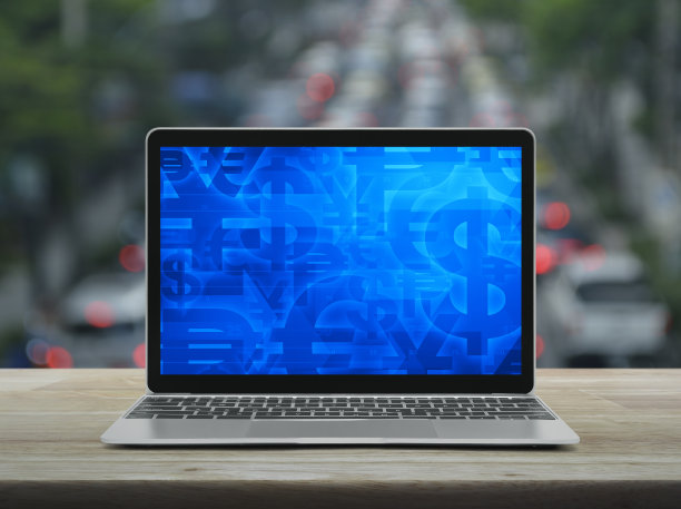 现代笔记本电脑屏幕上的金融货币符号图片下载