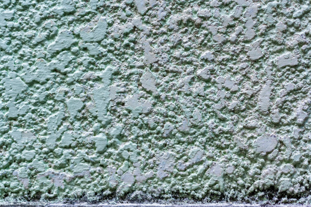 粉刷成绿色的旧混凝土墙。水平的。图片下载