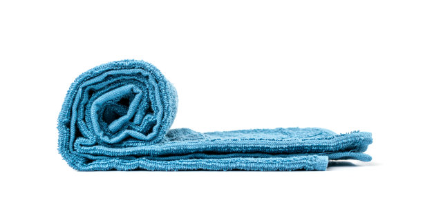 卷蓝色毛巾孤立。新Terry棉毛巾，软毛巾图片下载