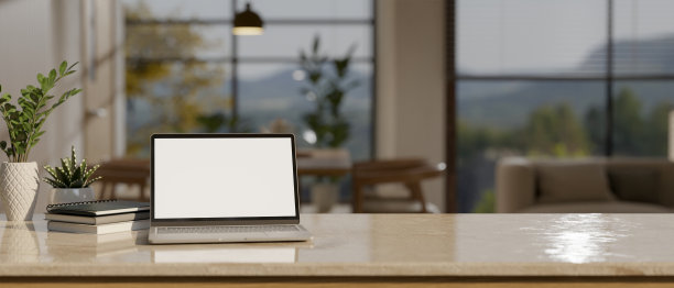 工作区与笔记本电脑模型和复制空间在桌面上模糊的现代客厅图片下载