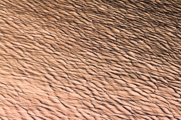 用米色表现抽象表面波纹的浮雕图片下载