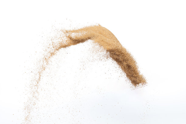 飞沙爆炸，金沙波爆炸。抽象的沙云飞。黄色的彩色沙子在空气中飞溅。隔离高速快门，抛出定格动作图片下载