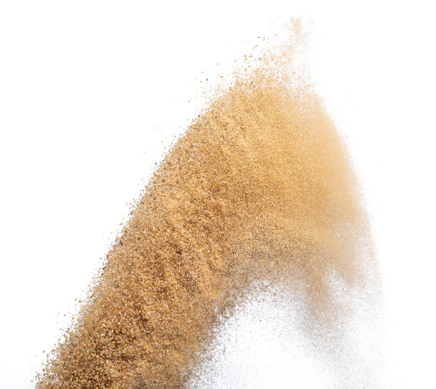 飞沙爆炸，金沙波爆炸。抽象的沙云飞。黄色的彩色沙子在空气中飞溅。隔离高速快门，抛出定格动作图片下载