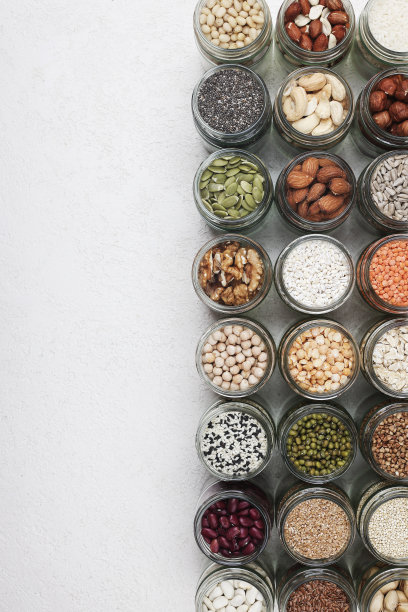 素食蛋白来源。健康的素食。顶视图种子，坚果，豌豆，豆类，大米，斯佩尔特，燕麦在白色背景复制空间图片下载