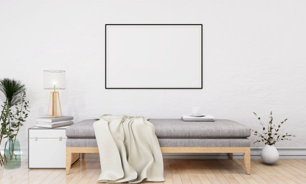 房间里有一张床，墙上有一个相框。图片下载