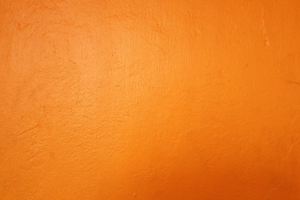 旧黄漆混凝土墙背景与光反射。图片下载