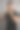 垂直拍摄的性感男性调整衣领，而站在灰色的墙图片下载