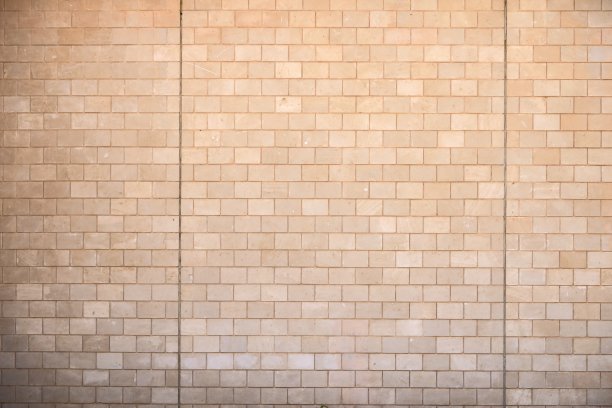 石砖砌成的黄色墙壁图片下载