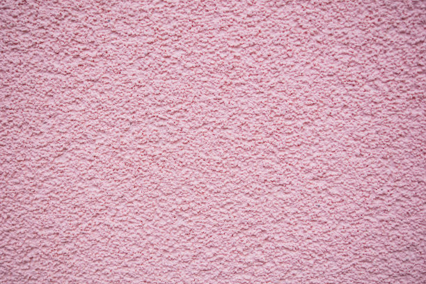 凹凸不平和粉状的粉色墙壁作为背景和纹理图片下载