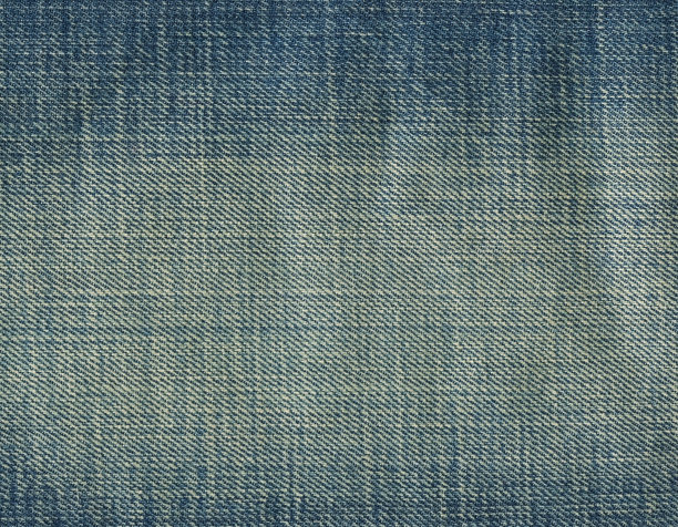 牛仔裤面料质感。高质量的库存照片。图片下载