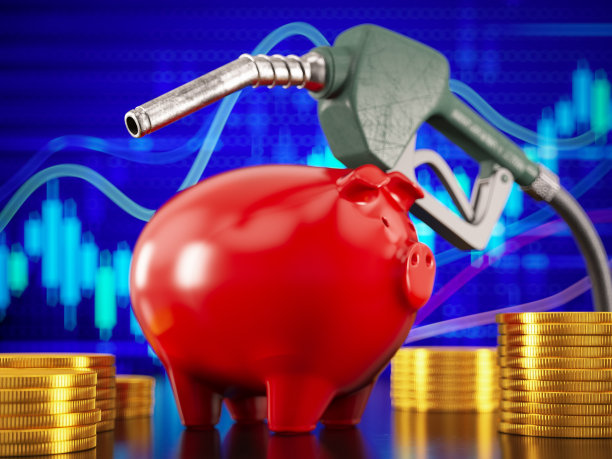 用硬币存钱罐和燃料喷嘴节省燃料钱的概念图片下载