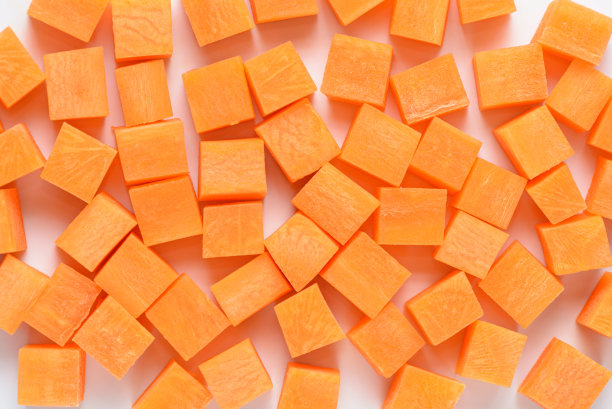 蔬菜胡萝卜根切丁，作为盖的背景图片下载