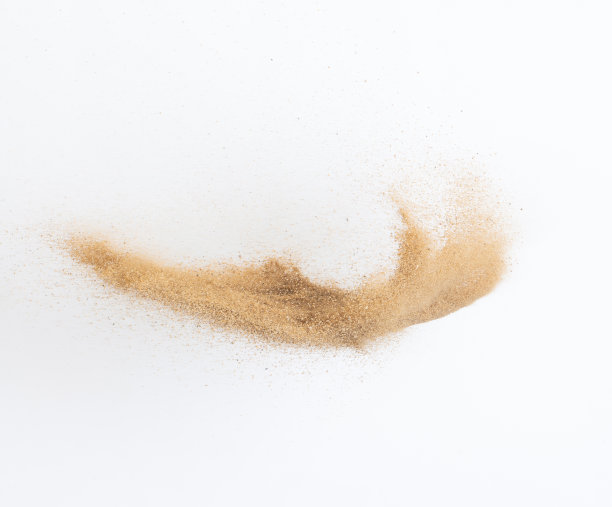 飞沙爆炸，金沙波爆炸。抽象的沙云飞。黄色的彩色沙子在空气中飞溅。隔离高速快门，抛出定格动作图片下载