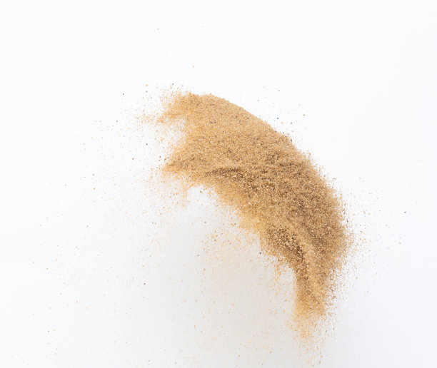 飞沙爆炸，金沙波爆炸。抽象的沙云飞。黄色的彩色沙子在空气中飞溅。隔离高速快门，抛出定格动作图片下载