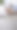 特写的女性使用手机在办公桌上使用应用程序或搜索社交媒体图片下载