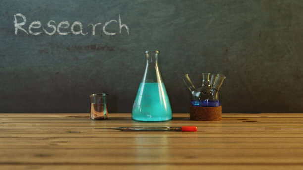 黑板背景前的化学玻璃器皿。黑板上写着“研究”。图片下载