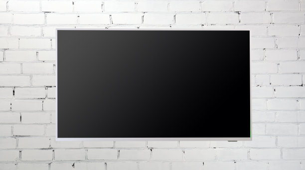 室内，白色砖墙上的银色LED电视。客厅。度假屋的概念。图片下载