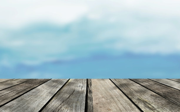 用蓝色的天空模拟野餐木桌面。图片下载